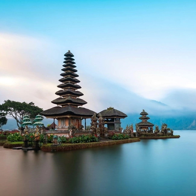 Indonesian temples in Bali, surrounded by lush greenery and picturesque landscapes, illustrating Balinese culture.