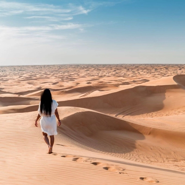 A woman walking in the desert