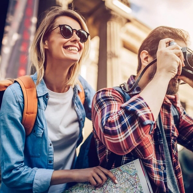 A man and a woman take a photo together with their camera, capturing a precious moment.