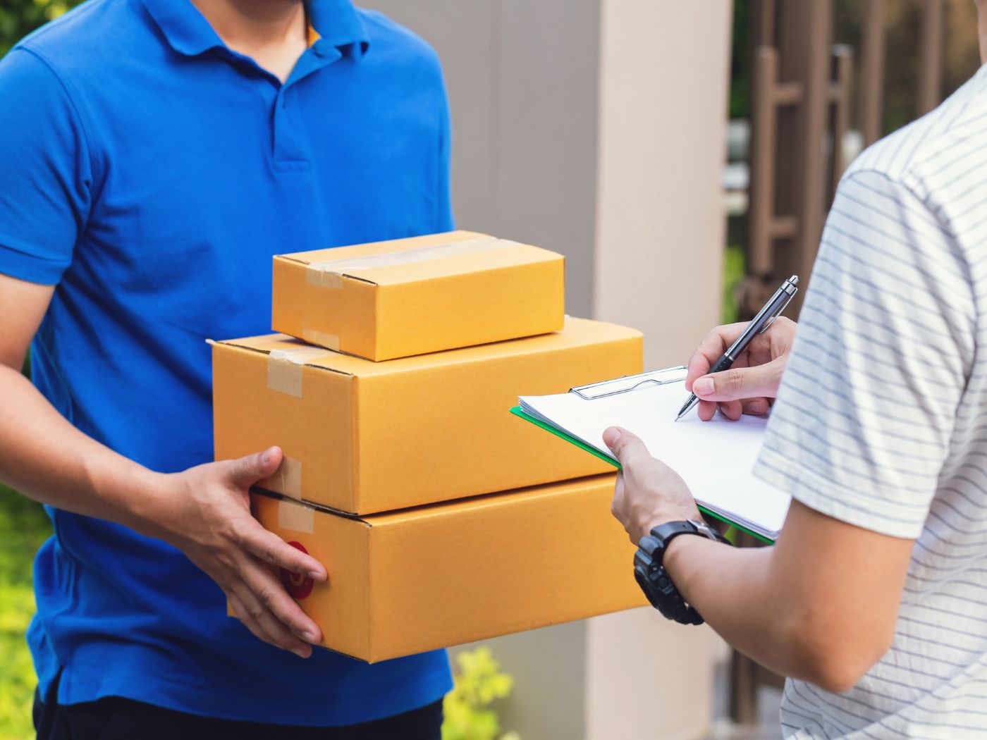 A person receiving a package at their doorstep