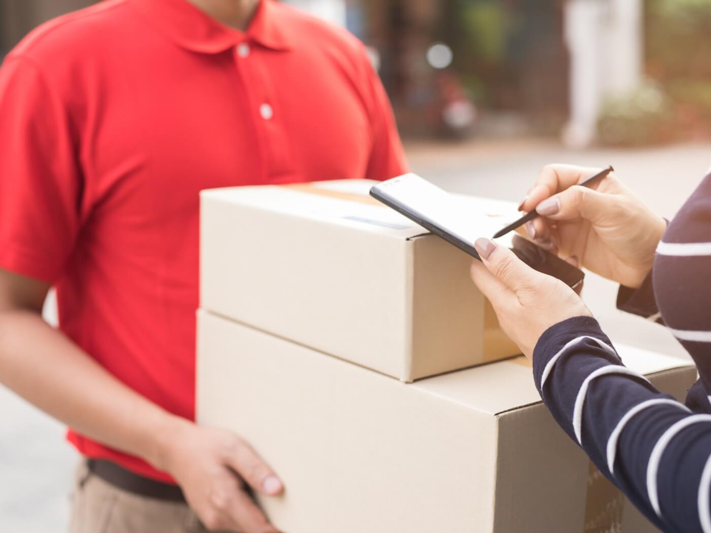 Customer receiving a package at home